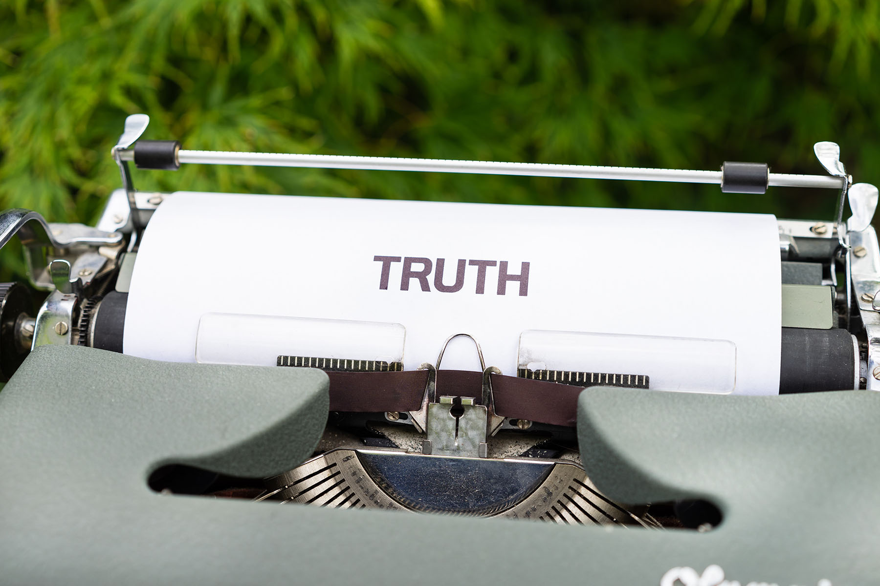 Typewriter with a paper that says 