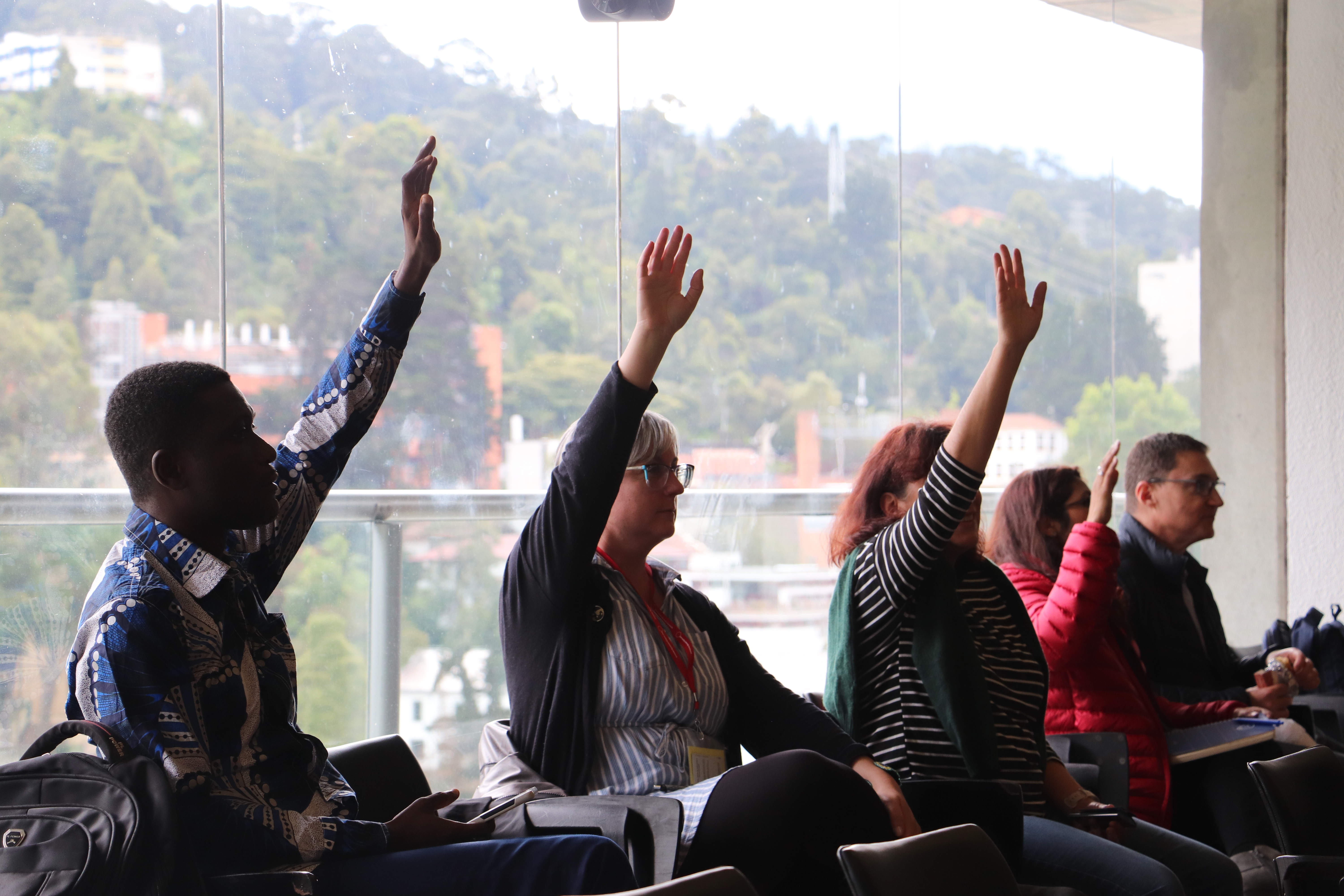 People with raised hands